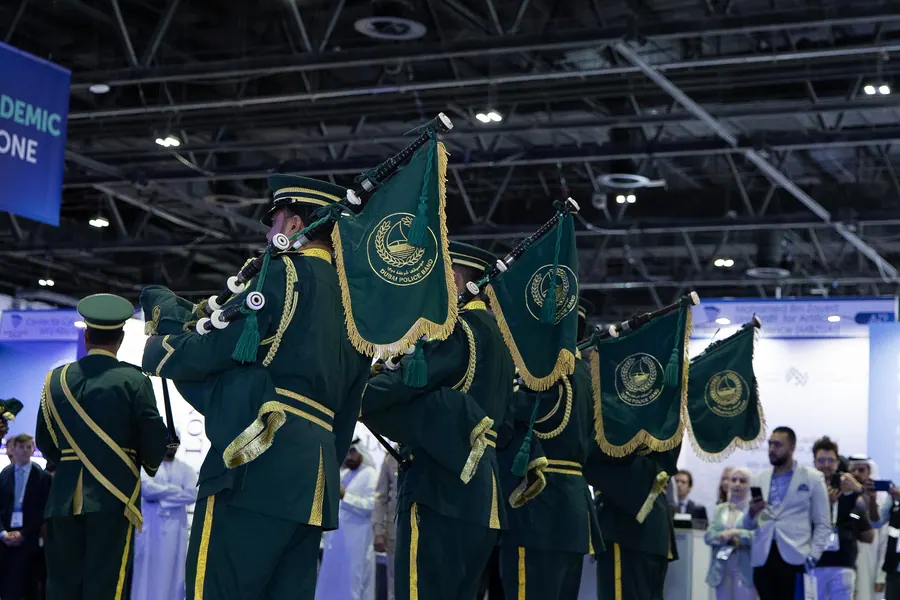 Ceremonial honour guard carrying flags at the World Police Summit 2025