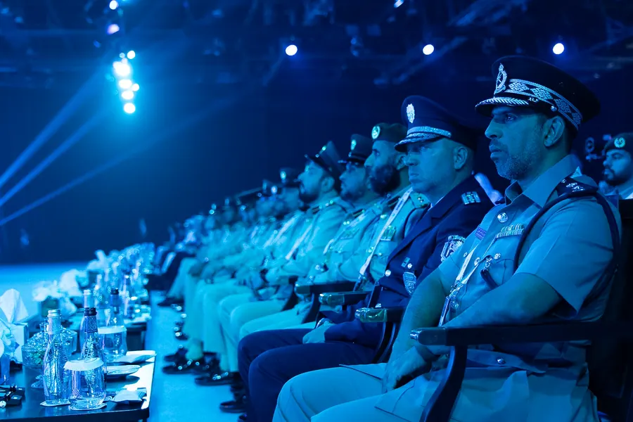 Senior police officers in uniform seated in the conference audience
