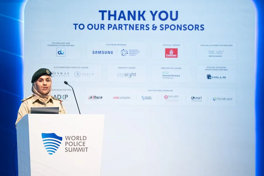 The partners and sponsors wall displayed on the main stage screen at the World Police Summit 2025